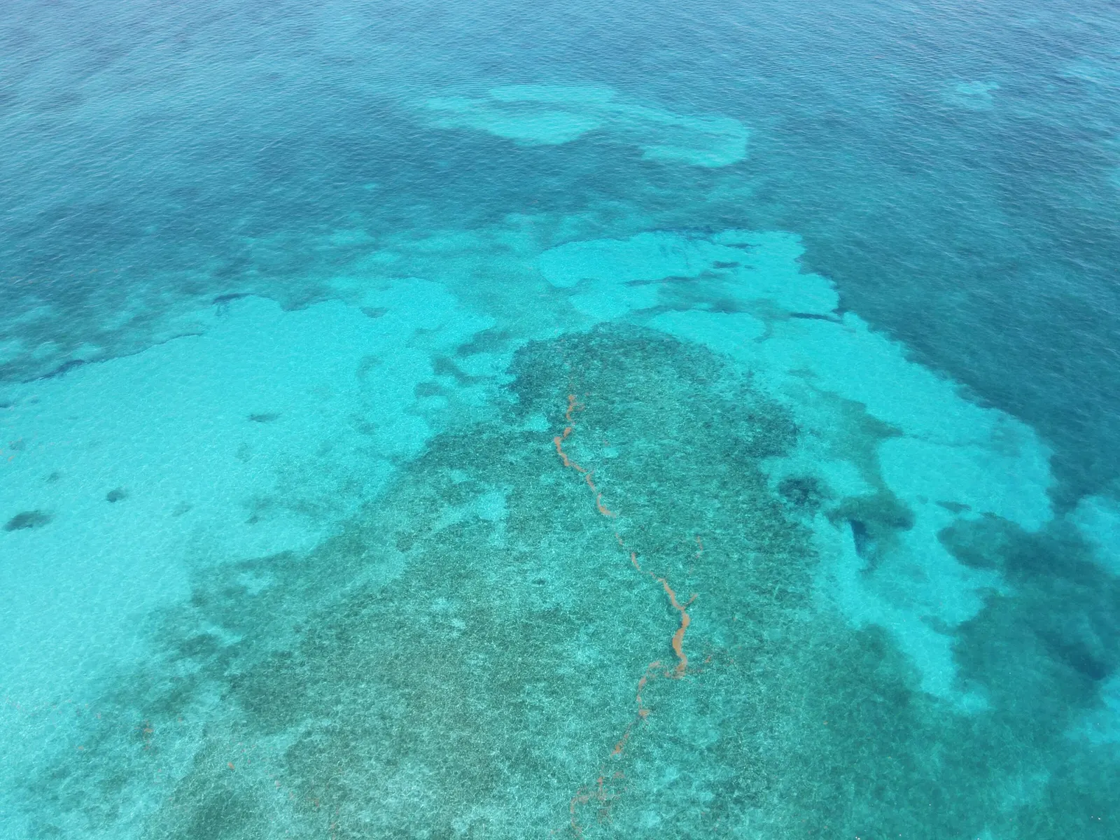 Aerial view of a shallow Florida Keys coral reef in turquoise water