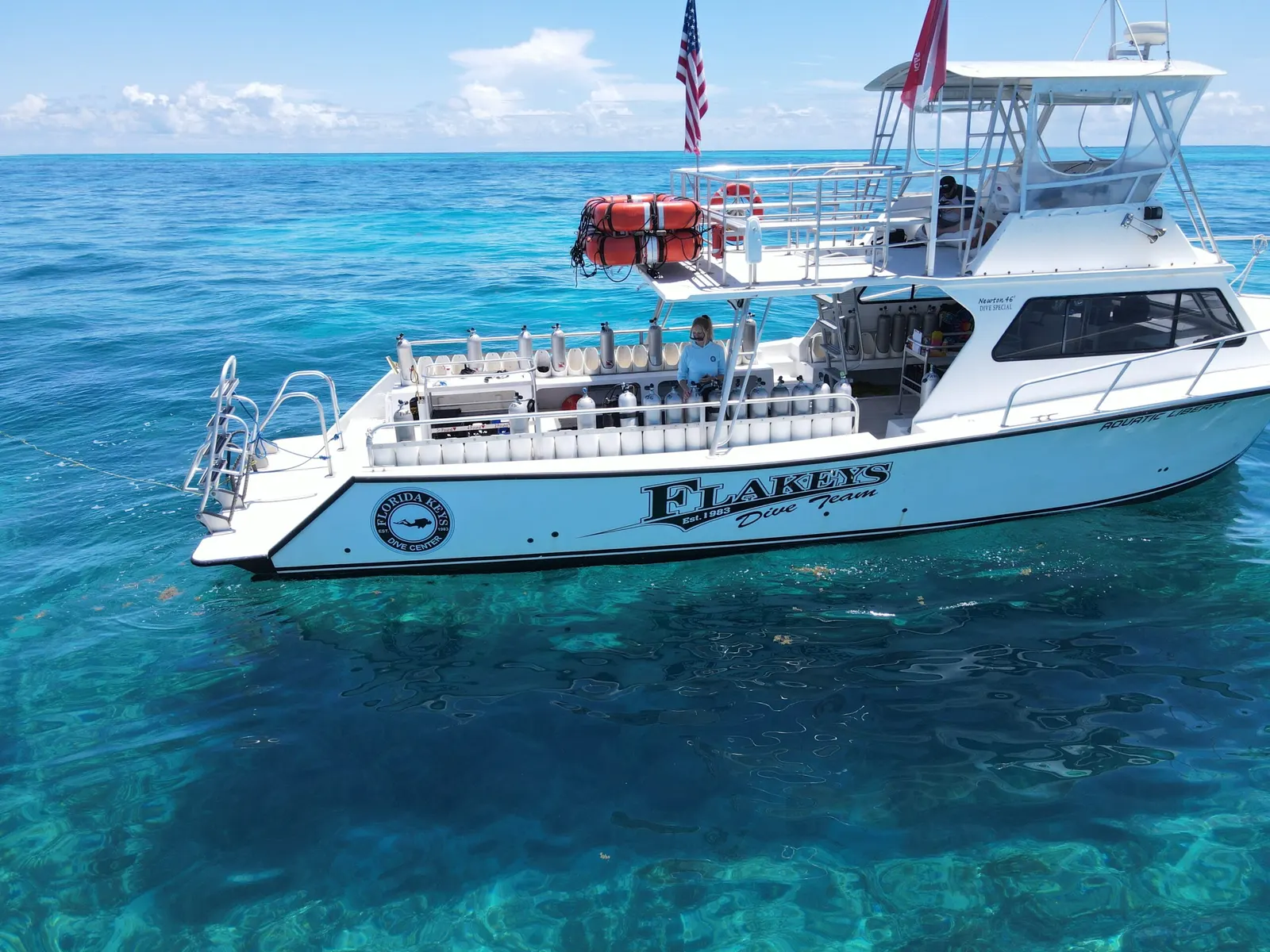 Florida Keys Dive Center boat on bright turquoise water at the reef